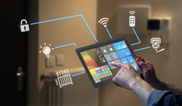 Home Energy ManagementInterface Two hands holding a tablet device showing a home energy management console.